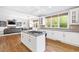 Spacious kitchen with granite countertops, stainless steel appliances, island, and hardwood floors at 1121 Vinings Grove Se Way, Smyrna, GA 30082