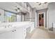 Bright main bathroom with double vanity, walk-in closet, and tiled floor at 1121 Vinings Grove Se Way, Smyrna, GA 30082