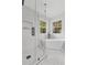 Modern bathroom with glass-enclosed shower and white freestanding tub at 3803 Upland Dr, Marietta, GA 30066