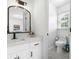 Chic bathroom features modern vanity, designer fixtures, and ample lighting to create a luxurious experience at 3803 Upland Dr, Marietta, GA 30066