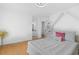 Cozy bedroom offers hardwood floors, comfortable bed, and an adjacent bathroom for a relaxing and private retreat at 3803 Upland Dr, Marietta, GA 30066