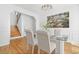 Elegant dining room showcasing a stylish chandelier, hardwood floors, and picturesque artwork at 3803 Upland Dr, Marietta, GA 30066