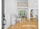 Bright foyer with hardwood floors, high ceilings, and a view into the adjacent living space at 3803 Upland Dr, Marietta, GA 30066