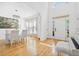 Bright foyer boasts hardwood floors, a grand staircase, and a glimpse into the elegant dining area at 3803 Upland Dr, Marietta, GA 30066