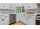 Bright kitchen features stainless appliances, wooden floors and white countertops at 3803 Upland Dr, Marietta, GA 30066