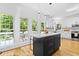 Bright kitchen with an island and views of the outdoor deck and foliage at 3803 Upland Dr, Marietta, GA 30066