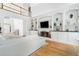 Bright living room with built-in shelves, fireplace, and wood floors at 3803 Upland Dr, Marietta, GA 30066