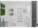 Bright bathroom with a soaking tub, marble countertops, and a view from the window at 5264 Prestley Crossing Ln, Douglasville, GA 30135