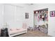 Bedroom for a girl featuring plush carpet, a closet, and white wood furniture at 5264 Prestley Crossing Ln, Douglasville, GA 30135