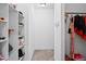 Walk-in closet with built-in shelving and hanging racks for optimal storage at 5264 Prestley Crossing Ln, Douglasville, GA 30135