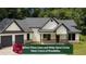 Inviting single-Gathering home featuring a two-car garage, stylish neutral paint, and a landscaped yard at 5264 Prestley Crossing Ln, Douglasville, GA 30135