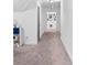 Second story hallway featuring plush carpet and access to bedrooms at 5264 Prestley Crossing Ln, Douglasville, GA 30135