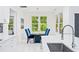 Bright eat-in kitchen features natural light and a view to the backyard at 5264 Prestley Crossing Ln, Douglasville, GA 30135