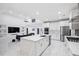 Open-concept living space featuring modern kitchen, living room, and dining area at 5264 Prestley Crossing Ln, Douglasville, GA 30135