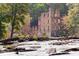 River and historic building ruins surrounded by trees at 5264 Prestley Crossing Ln, Douglasville, GA 30135