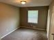 Bedroom features neutral carpet and natural light at 8415 Magnolia Dr, Jonesboro, GA 30238