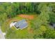 Aerial shot displays the house on a spacious lot with a forest backdrop at 190 Paul Aiken Rd, Dallas, GA 30157