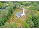 High-angle view of a house nestled in the woods featuring ample lot space at 190 Paul Aiken Rd, Dallas, GA 30157