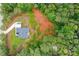 Bird's-eye view of a home on a large lot with a cleared area near the woods at 190 Paul Aiken Rd, Dallas, GA 30157