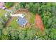 Overhead view showcasing the house with a trampoline in the wooded surroundings at 190 Paul Aiken Rd, Dallas, GA 30157
