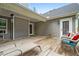 This is an outside view of a back porch with an outdoor seating area and a wooden floor at 190 Paul Aiken Rd, Dallas, GA 30157