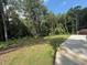 Expansive backyard with lush greenery and mature trees creating a private oasis at 190 Paul Aiken Rd, Dallas, GA 30157