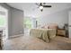 Bright bedroom with ceiling fan and ensuite bathroom, showcasing ample natural light at 190 Paul Aiken Rd, Dallas, GA 30157
