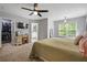 Spacious bedroom with plush carpeting, ceiling fan, walk-in closet, and ensuite bathroom at 190 Paul Aiken Rd, Dallas, GA 30157