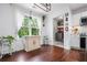 Breakfast nook features wood floors, bright windows with sheer curtains, and views of backyard at 190 Paul Aiken Rd, Dallas, GA 30157