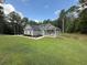 Attractive single-Gathering home featuring a well-maintained lawn and a covered front porch, surrounded by mature trees at 190 Paul Aiken Rd, Dallas, GA 30157
