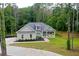 Inviting single-story home with a well-manicured lawn and a covered porch for relaxation at 190 Paul Aiken Rd, Dallas, GA 30157
