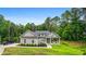 Charming single-story home featuring a covered front porch and lush landscaping at 190 Paul Aiken Rd, Dallas, GA 30157