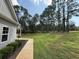 Well-manicured lawn and lush greenery complement this charming home's exterior at 190 Paul Aiken Rd, Dallas, GA 30157