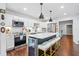 Modern kitchen features stainless steel appliances, white cabinetry, subway tile backsplash, and a wine fridge at 190 Paul Aiken Rd, Dallas, GA 30157