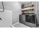 Well-organized laundry room with updated appliances, open shelving, and modern decor at 190 Paul Aiken Rd, Dallas, GA 30157
