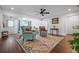 Open-concept living room featuring hardwood floors, bright trim, and comfortable seating area at 190 Paul Aiken Rd, Dallas, GA 30157