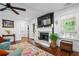 Open-concept living room featuring fireplace, and large windows with natural light at 190 Paul Aiken Rd, Dallas, GA 30157