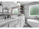 Well-appointed bathroom with double sinks, marble countertops, and open shelving at 190 Paul Aiken Rd, Dallas, GA 30157