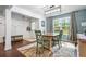 Welcoming mud room adjacent to the dining room features coat hooks and a bench at 190 Paul Aiken Rd, Dallas, GA 30157