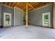 Covered patio with dual entry doors and stacked wood at 190 Paul Aiken Rd, Dallas, GA 30157