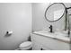 Stylish powder room with modern fixtures, black faucet, marble counters and grey paint at 190 Paul Aiken Rd, Dallas, GA 30157