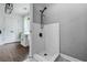 Tile shower featuring a modern design with glass enclosure and sleek fixtures at 190 Paul Aiken Rd, Dallas, GA 30157