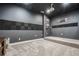Cozy home theater with dark walls and acoustic panels at 190 Paul Aiken Rd, Dallas, GA 30157