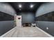 Home theater featuring dark walls, acoustic panels, and carpet at 190 Paul Aiken Rd, Dallas, GA 30157