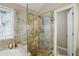 Bathroom showcases a glass shower with granite tiles and an attached tub at 1925 Waters Ferry Dr, Lawrenceville, GA 30043