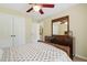The bedroom has a double door closet and a vintage wooden dresser with a full mirror at 1925 Waters Ferry Dr, Lawrenceville, GA 30043