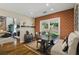 Charming dining area with brick accent wall and access to the backyard at 1925 Waters Ferry Dr, Lawrenceville, GA 30043