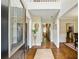 Entryway foyer featuring hardwood floors and an open view to the rest of the home at 1925 Waters Ferry Dr, Lawrenceville, GA 30043