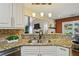Kitchen island with granite counters overlooks the living area, seamlessly connecting living and dining spaces at 1925 Waters Ferry Dr, Lawrenceville, GA 30043