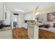 Modern kitchen boasts granite countertops, stainless steel appliances, and a breakfast bar overlooking the living area at 1925 Waters Ferry Dr, Lawrenceville, GA 30043